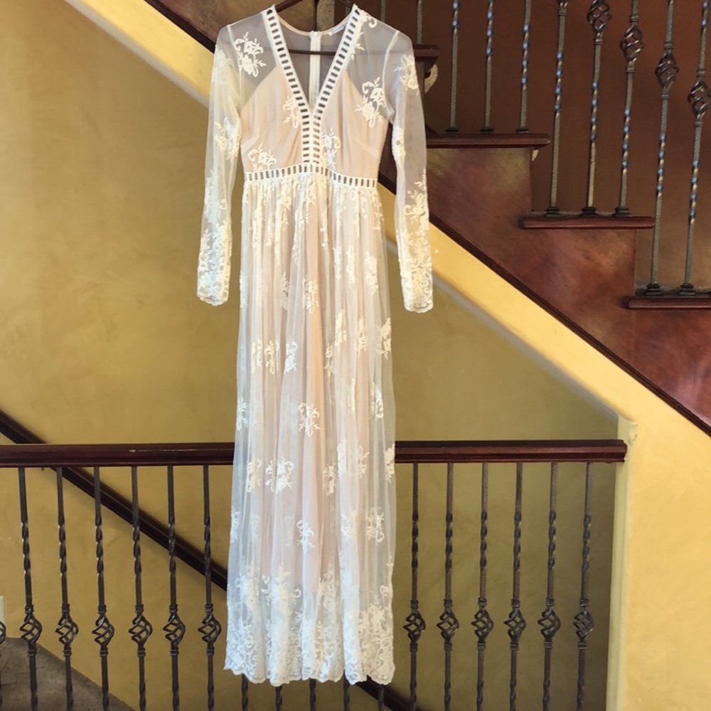 This cream and nude dress has only been worn once and is in perfect condition.